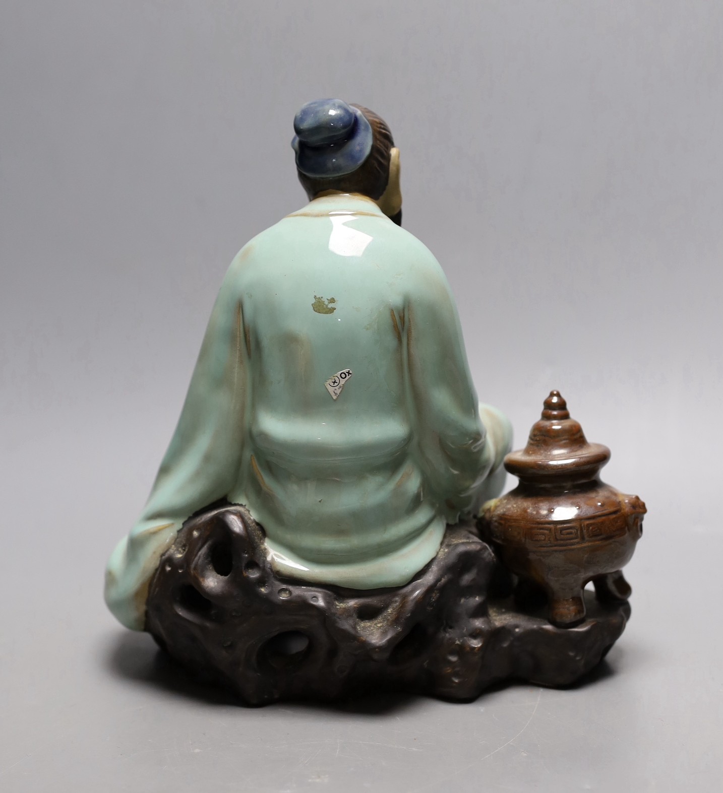 A Chinese Shiwan pottery figure. 23cm tall